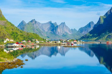 Perfect reflection of the Reine village on the water of the fjord in the Lofoten Islands, Norway