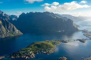 Amazing landscape of the Lofoten Islands from the top of Reinebringen Mountain with blue sky, Norway