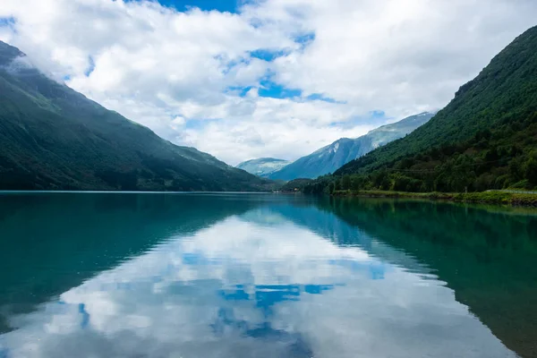 Landscape of the Lovatnet glacial lake with turquoise crystal clear water, Norway