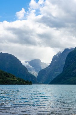 Landscape of the Lovatnet glacial lake with turquoise crystal clear water, Norway