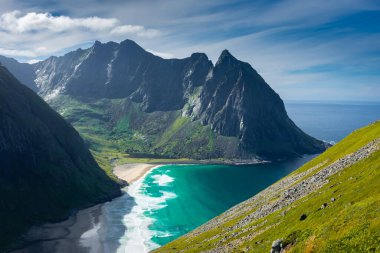 View over the turquoise water of Kvalvika Beach from Ryten Mount, Lofoten Islands, Norway