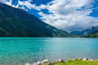 Landscape of the Lovatnet glacial lake with turquoise crystal clear water, Norway