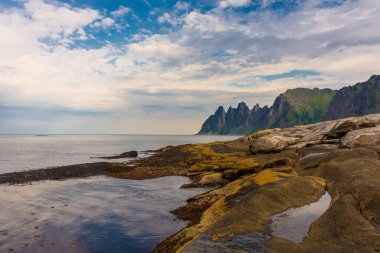 The Tungeneset (Devil's Teeth), mountains over the ocean in Senja Island, Norway