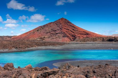 Sulfur lake in front of a volcano in Lanzarote, Canary Islands, Spain clipart