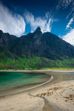 The crystal clear water of the Ersfjordstranda beach in Senja Island, Norway