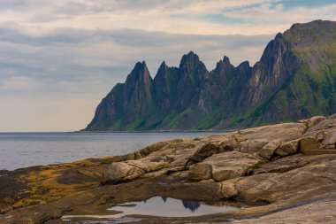 The Tungeneset (Devil's Teeth), mountains over the ocean in Senja Island, Norway