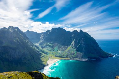 View over the turquoise water of Kvalvika Beach from Ryten Mount, Lofoten Islands, Norway