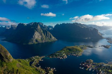 Amazing landscape of the Lofoten Islands from the top of Reinebringen Mountain with blue sky, Norway