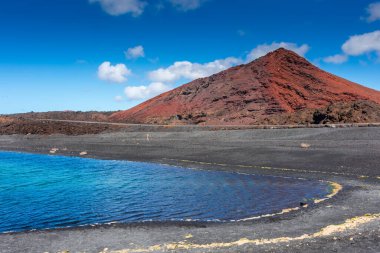 Sulfur lake in front of a volcano in Lanzarote, Canary Islands, Spain