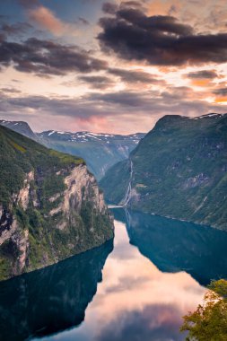 Sunset over the Geirangerfjord and the Seven Sisters Waterfall, Norway