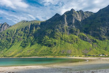 The crystal clear water of the Ersfjordstranda beach in Senja Island, Norway