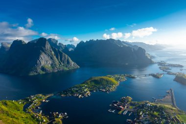 Amazing landscape of the Lofoten Islands from the top of Reinebringen Mountain with blue sky, Norway