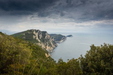 Hiking trail by the Ligurian sea with cloudy sky to Portovenere, Italy