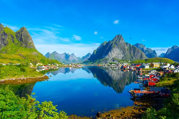 Perfect reflection of the Reine village on the water of the fjord in the Lofoten Islands, Norway