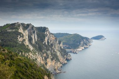 Hiking trail by the Ligurian sea with cloudy sky to Portovenere, Italy