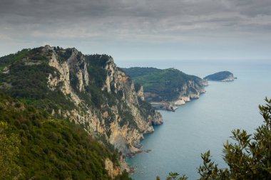 Hiking trail by the Ligurian sea with cloudy sky to Portovenere, Italy