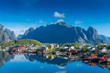 Perfect reflection of the Reine village on the water of the fjord in the Lofoten Islands, Norway