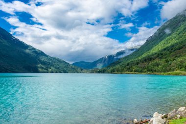 Landscape of the Lovatnet glacial lake with turquoise crystal clear water, Norway
