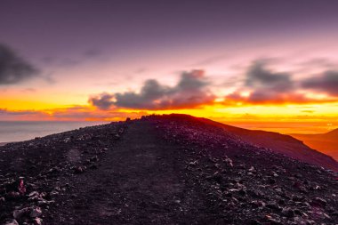 Spectacular sunset over the Fagradalsfjall, active volcano in Iceland, ocean in the background clipart