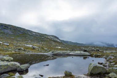 Lake in the trail to hike to Trolltunga scenic spot, Norway