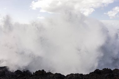 Powerful waves of the Atlantic Ocean crashing on the volcanic cliffs of Los Hervideros in Lanzarote, Canary Islands, Spain