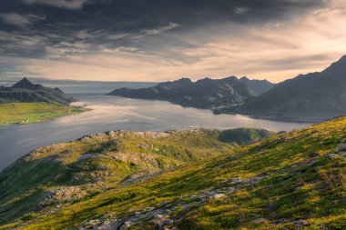 Beautiful landscape of the Lofoten Islands during the golden hour, view from Offersoy Mount trail, Norway