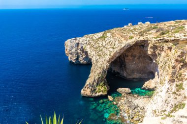 The Blue Grotto of Malta, rock formation on the sea with crystal clear water