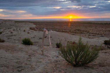 Sunset over the Aral Sea desert, Uzbekistan clipart