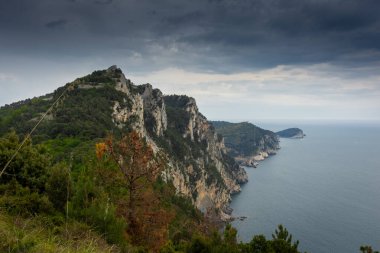 Hiking trail by the Ligurian sea with cloudy sky to Portovenere, Italy
