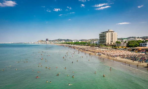 stock image  Golem, Durres, Albania - 22 august 2023: Aerial view to sandy beach full of umbrellas and people in summer season 2023. High quality photo