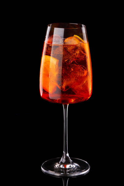 Aperol spritz summer cocktail in mister glass with bubbles. For restaurant menu.