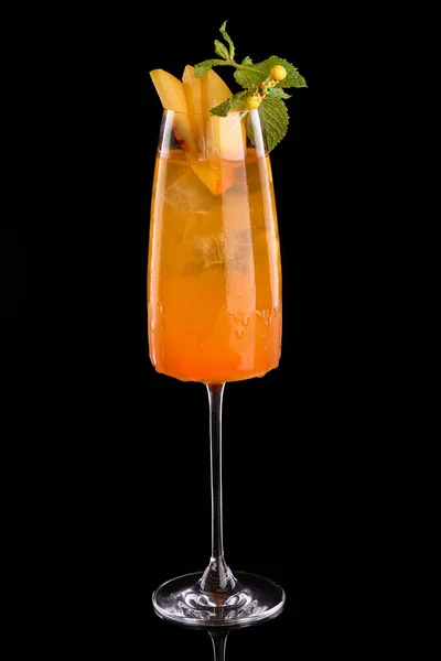 Frozen Peach Bellini cocktail summer drink.Black background