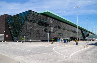 Balice, Poland - September 11, 2022: John Paul II Krakow Balice International Airport, one of the busiest airports in Poland. Modern glass facade of Krakow passenger terminal.