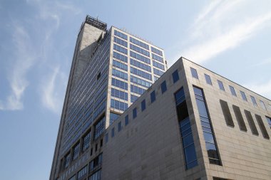 Katowice, Poland - July 22, 2022: Altus building (Uni Centrum, Business Center 2000). Courtyard by Marriott Katowice City Center skyscraper.