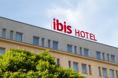 Krakow, Poland - May 19, 2022: Ibis Krakow Stare Miasto logo sign. 3-star hotel in Old Town district. French hotels chain, signboard with company brand logotype.