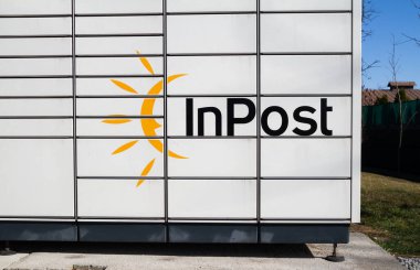 Krakow, Poland - March 24, 2022: Smart electronic steel parcel locker box, automatic mailboxes. Package collection machine, InPost Paczkomat delivery service.