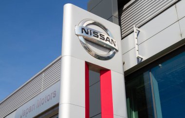 Krakow, Poland - March 27, 2022: Nissan Motor Japan Corporation logo. Japanese car manufacturer sign. Dealership forecourt pylon signboard with company brand logotype.
