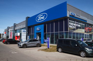 Krakow, Poland - March 27, 2022: Ford Motor Company car dealership building. American manufacturer auto salon with logo sign. Showroom signboard with corporation brand logotype.