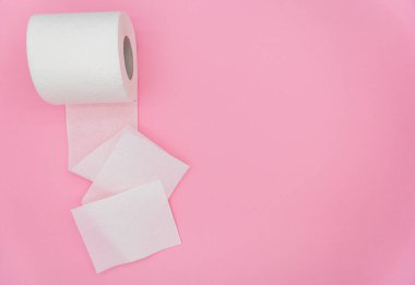 White roll of toilet paper on color background. Hygiene concept. Empty place for text or logo.