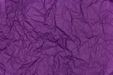 Purple crumpled paper background. Texture of crumpled paper.