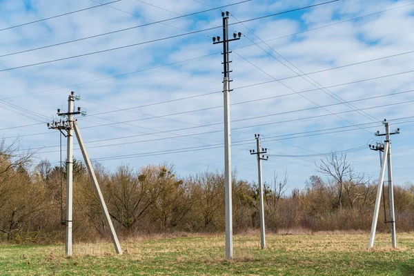 The line of electric poles with cables of electric.