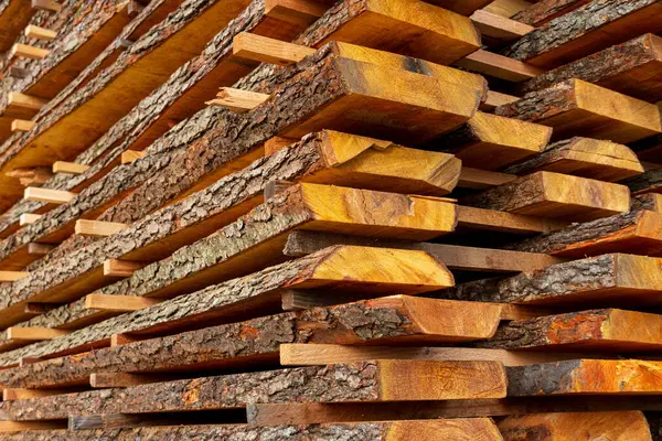 A boards in an industrial sawmill. Wood timber construction material.