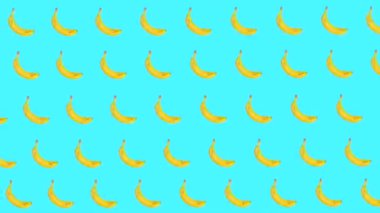 Muz arka planında, muz arka planında birçok muzun hareketinin modern modaya uygun gıda animasyonu. Yüksek kalite 4k görüntü