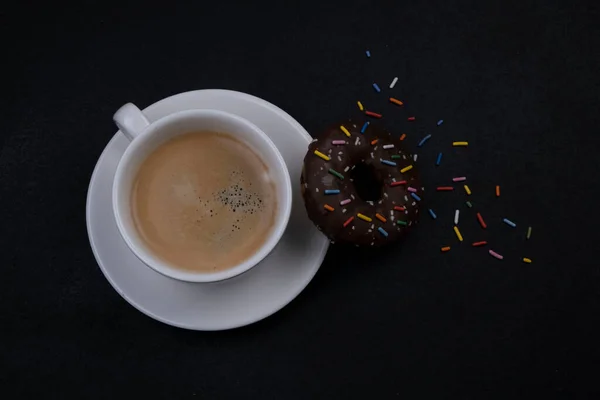 Takes Coffee Chocolate Donut Multi Colored Sprinkles Black Background Top — Stock Photo, Image