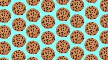Moda yemek animasyonu, döngülü arka plan veya çikolatalı kurabiyelerin mavi zemin üzerindeki damlaları.