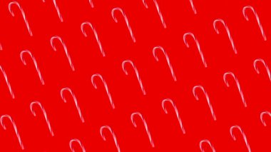 Kırmızı arka planda şeker kamışlı Noel animasyonu, yeni yıl konsepti. Yüksek kalite 4k görüntü