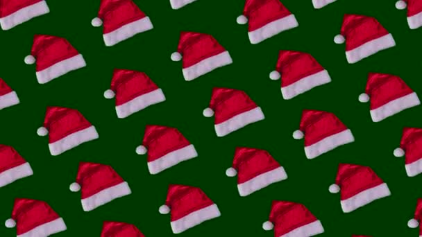 Zapętlone Christmas Animacji Santa Claus Kapelusze Zielonym Tle Wzór Wakacje — Wideo stockowe