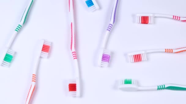 Background Dental Toothbrushes Different Colors White Background Top View High — Stok video