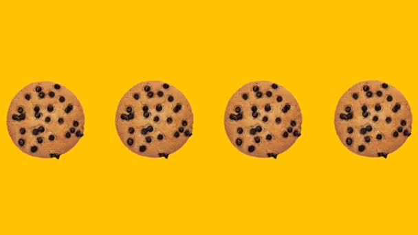 Trendy Food Animation Spinning Cookies Chocolate Drops Yellow Background — Stockvideo