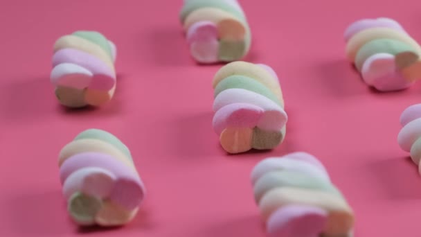 Rotating Multi Colored Chewy Marshmallows Pink Background Concept Birthday Holiday — Stock Video
